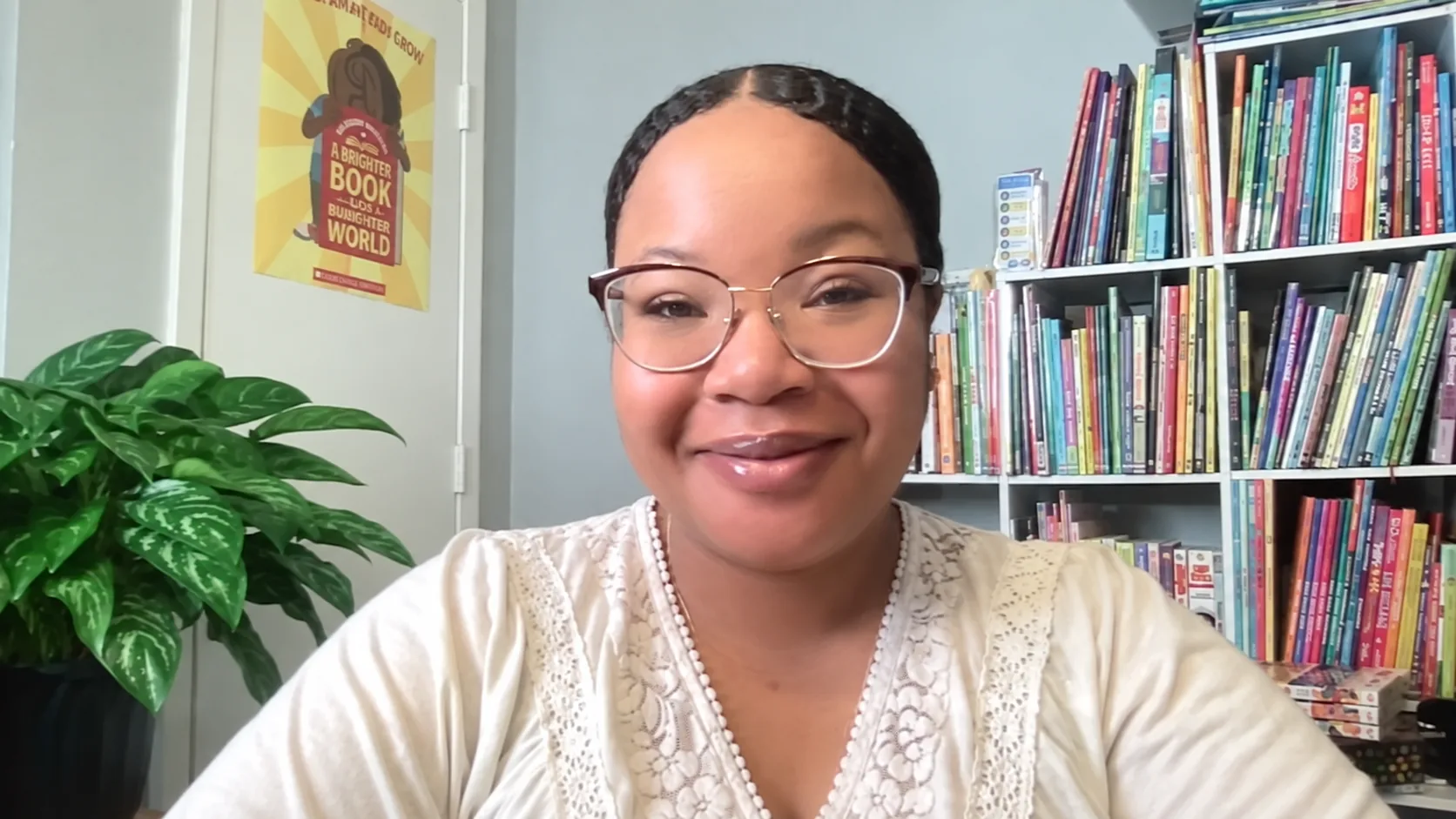 Quinn smiling in her reading room; restored video still